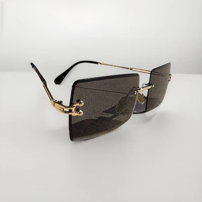 Gafas de sol sin montura Horsebit con montura dorada para mujer retro hip hop lentes tintadas de lujo Foto 1 de 4