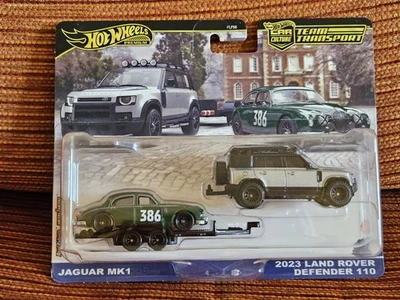 # 1/64 HOT WHEELS TEAM TRANSPORT #74 - JAGUAR MK.1 + LAND ROVER DEFENDER 110 # - Immagine 1 di 2