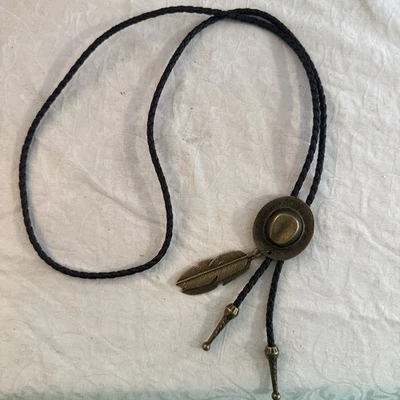 BLACK Leather Bolo Tie with Bronze/Gold Tone Western Hat, Feathers & Ends - Image 1 of 4