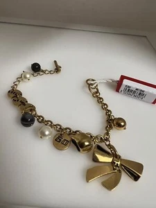 Pulsera Miss Sixty lazo dorado nueva con etiquetas - Imagen 1 de 2