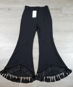 Pantalones de mujer Zara negro liso acampanados con flecos talla XS - Imagen 1 de 8