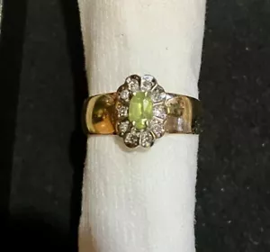 PERIDOT LADIES RING SURROUNDED BY 10 DIAMONDS SET IN 14KT YELLOW GOLD BAND - Picture 1 of 1