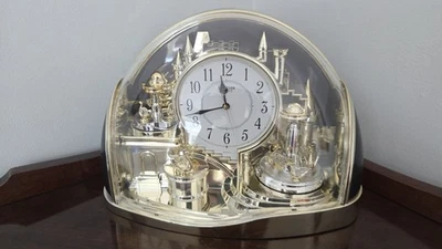 Rhythm Mantel Clock Enchanted Kingdom Rotating Swan Pendulums  Gold  4SG738WR18 - Image 1 of 3