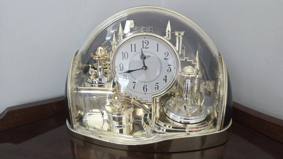 Rhythm Mantel Clock Enchanted Kingdom Rotating Swan Pendulums  Gold  4SG738WR18 - Image 1 of 3