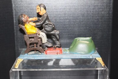 Vintage Dentist Chair Cast Iron Mechanical Bank  Book Of Knowledge Repro Excelle - Image 1 of 4