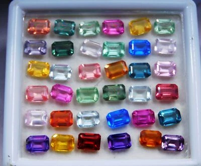 Lote de 14 piedras preciosas CERTIFICADAS color mezcla natural zafiro corte esmeralda 7x5 mm. Foto 1 de 4