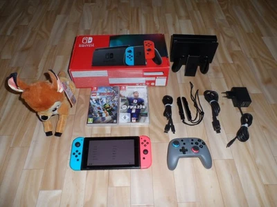 Nintendo Switch Konsole Neon Rot Neon Blau in OVP + Controller + 2x Spiele - Bild 1 von 4