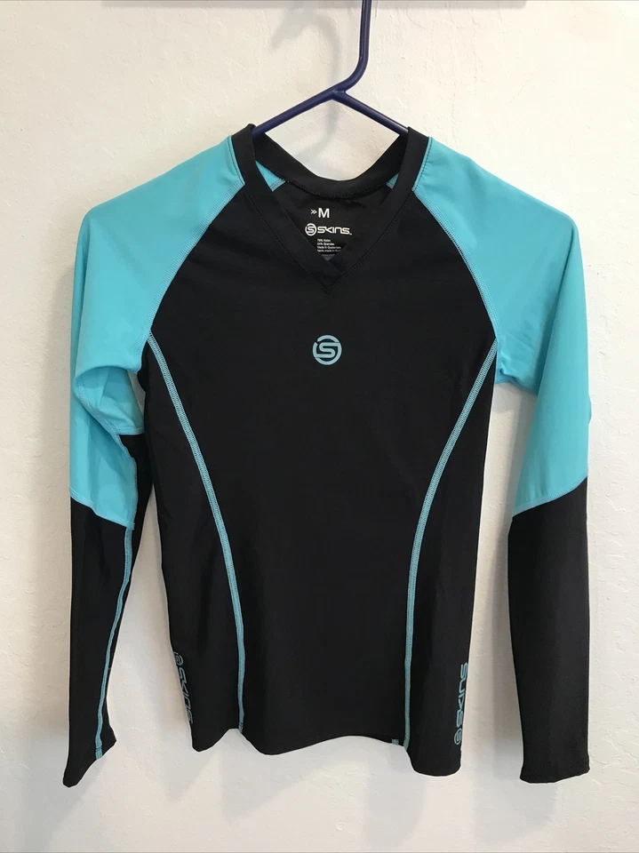 Camisa de ciclismo Skins manga larga negra azul talla juvenil M Foto 1 de 4