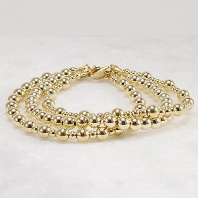 Trío de brazalete de cuentas relleno de oro de 14k · Pila de oro minimalista · Joya de lujo diario Foto 1 de 4