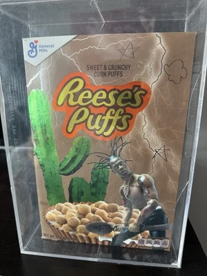 Travis Scott X Reese’s Puffs Cereal Limited Edition Box With Acrylic Case - Image 1 of 4