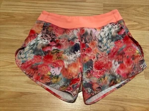 Athleta Girl Orange Floral Run The World Shorts Size 12 - Picture 1 of 4