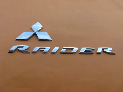 06 07 08 09 10 11 MITSUBISHI RAIDER REAR GATE EMBLEM LOGO BADGE SIGN USED A41567 - Image 1 of 4