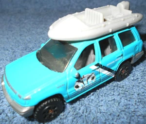 1999 MATCHBOX JEEP GRAND CHEROKEE OCEAN RESEARCH 1:58 DIECAST WITH RAFT - NICE - Picture 1 of 10