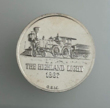 The Highland Light 1867 Train Golden State Mint 1 Ounce .999 Silver Round