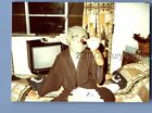FOUND COLOR PHOTO L_4717 BOY SITTING ON BED WEARING YODA MASK