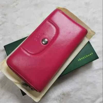 ❅�Cartera LONGCHAMP de cuero rosa con cremallera alrededor Foto 1 de 4