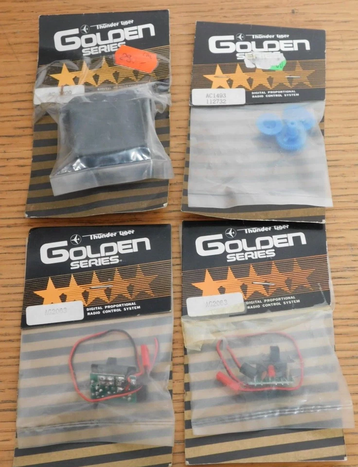 LOT 4 THUNDER TIGER GOLDEN SERIES S15 AC1493 AC1490 AG2063 PIGNON boitier SERVO - Photo 1/4