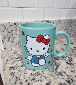"TAZA DE TÉ HELLO KITTY RAINBOW CAFÉ COLOR VERDE AZULADO CLARO 4"" X 3" - Imagen 1 de 4