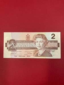 Billete de 2 dólares Thiessen/Cuervo de Canadá 1986 sin circular - Imagen 1 de 2