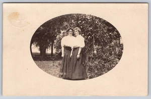 Postcard RPPC Two Young Women Standing Outside - Picture 1 of 3