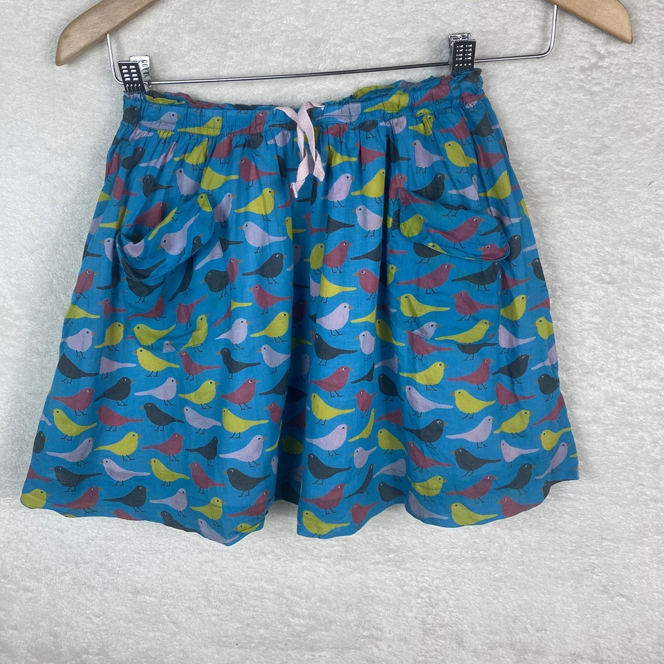 迷你紧身花卉蓝色鸽子鸟印花口袋裙衬里女孩尺寸 7-8 — 第 1/4 张图片