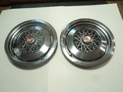 Par de cubiertas de rueda de alambre tapacubos OEM Ford Mustang II 1974-1978 Foto 1 de 4