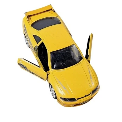 Nissan Skyline GT-R 1995 diecast escala 1:32 amarillo Fast & Furious Jada Toys Foto 1 de 4