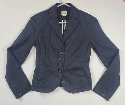 Chaqueta negra Converse One Star para dama talla XS manga larga ajustada con volantes en la espalda Foto 1 de 4