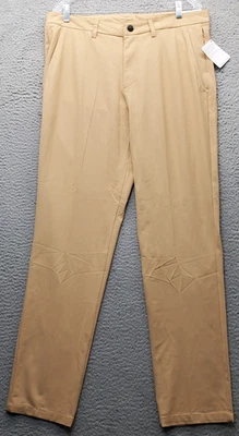 Pantalones de rendimiento de golf Reebok para hombre 34x32 tostados bolsillo cortado pierna cónica atlética Foto 1 de 4