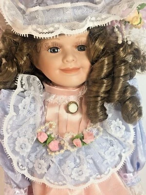 Ashley Bell Porcelain Doll 16" with Stand 1-6000 Blue Peach Lace Frilly - Image 1 of 4