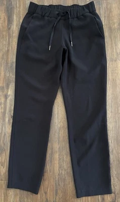 Pantalones para mujer Lululemon 4 On The Fly tejidos 27" recortados negros con cordón Travel-C Foto 1 de 4
