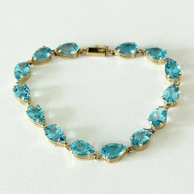 Pulseira de tênis de ouro amarelo 10K genuína topázio azul corte pera - Imagem 1 de 4