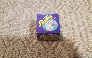 The Original Metal Slinky Walking Spring Toy 2000 James Indus NOS Sealed No. 100 - Picture 1 of 6