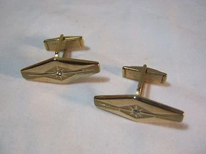 Gemelos afilados tono dorado con centro en forma de estrella joyería vintage  - Imagen 1 de 4