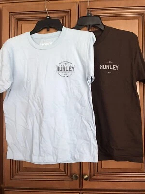 Two New LB/Br Hurley Kids Orange & Brown HB/CA Graphic T-Shirts Size M X2 Set - Image 1 of 4