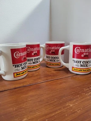 4 tazas de cacao caliente Clavel Foto 1 de 4