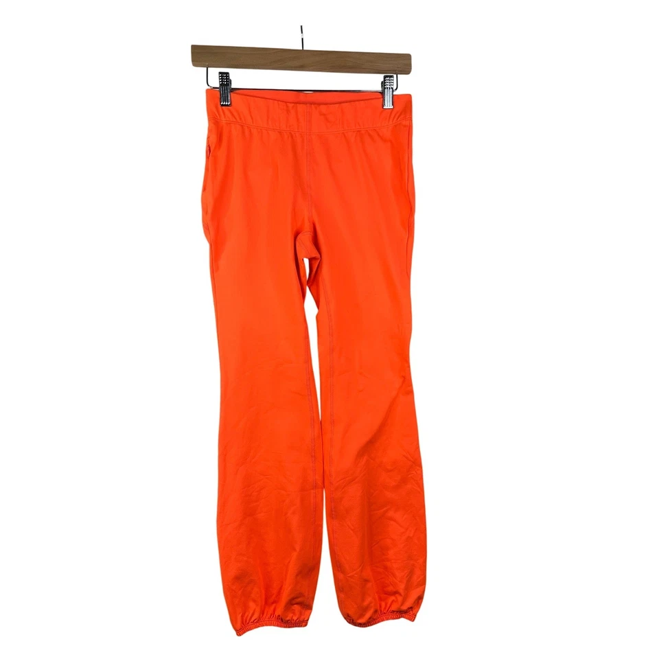 Pantalones cintura elástica Free People Movement talla pequeña naranja Foto 1 de 4