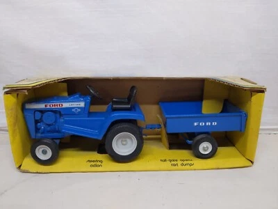 Ertl Ford LGT 145 Lawn and Garden Tractor Set w Trailer 1/12 - Image 1 of 4