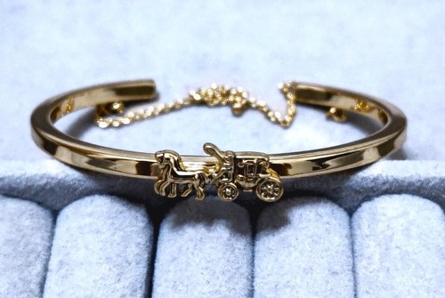 Bracciale bracciale COACH Coach motivo carrozza colore oro 38988