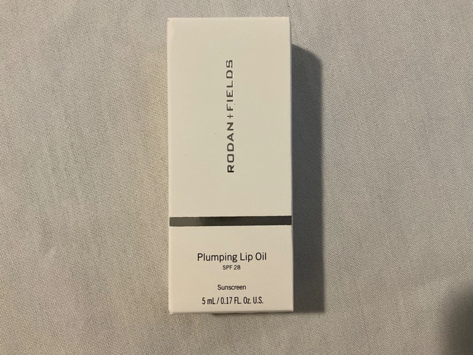 RODAN + FIELDS Plumping Lip Oil SPF 28 Sunscreen 0.17 fl oz CORAL EXP 01/2026 - Image 1 of 4