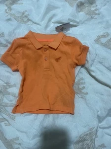 Orange polo shirt 3-6 month primark good condition - Picture 1 of 3