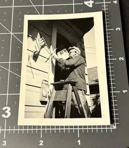 1940s Man Installing AMERICAN FLAG USA Patriotic Antique Snapshot PHOTO - Picture 1 of 3