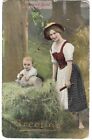 Woman with a baby in a wheel barrow vintage Ethnic Greetings Postcard  