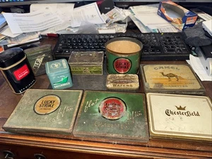 10 boîtes à cigarettes anciennes diverses Lucky Strike Camel Chesterfield Raptco Greenbrier - Photo 1/7