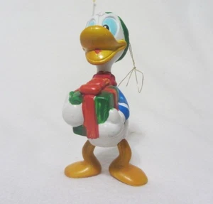 VINTAGE DISNEY'S DONALD DUCK HOLDING GIFT ORNAMENT - Picture 1 of 5