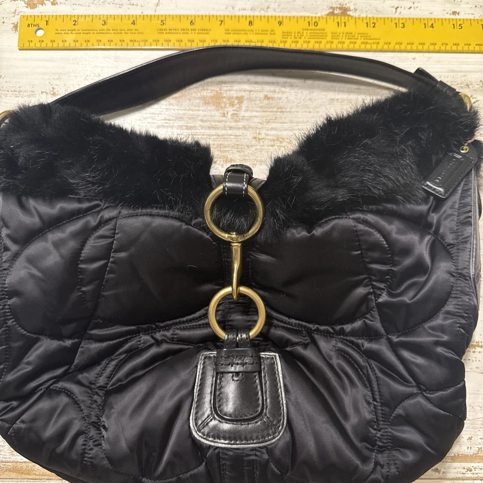 Cartera Coach de piel negra Foto 1 de 4