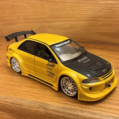 Jada Toys Mitsubishi Lancer Evolution VI Amarillo Escala 1:24 Lo último raro Foto 1 de 4