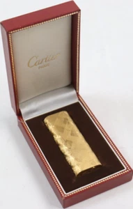 Encendedor de gas Cartier dorado ovalado en funcionamiento con caja - Imagen 1 de 8