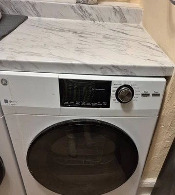 GE GFD14ESSNWW 24" 4.3 cu ft Vented Front Load Stackable Electric Dryer in White - Image 1 of 4