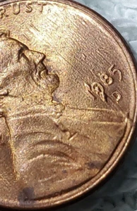 1985 Lincoln Cent date Error letters in background  - Picture 1 of 4